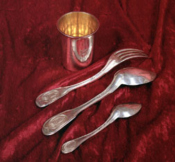 Silver cutlery and cup