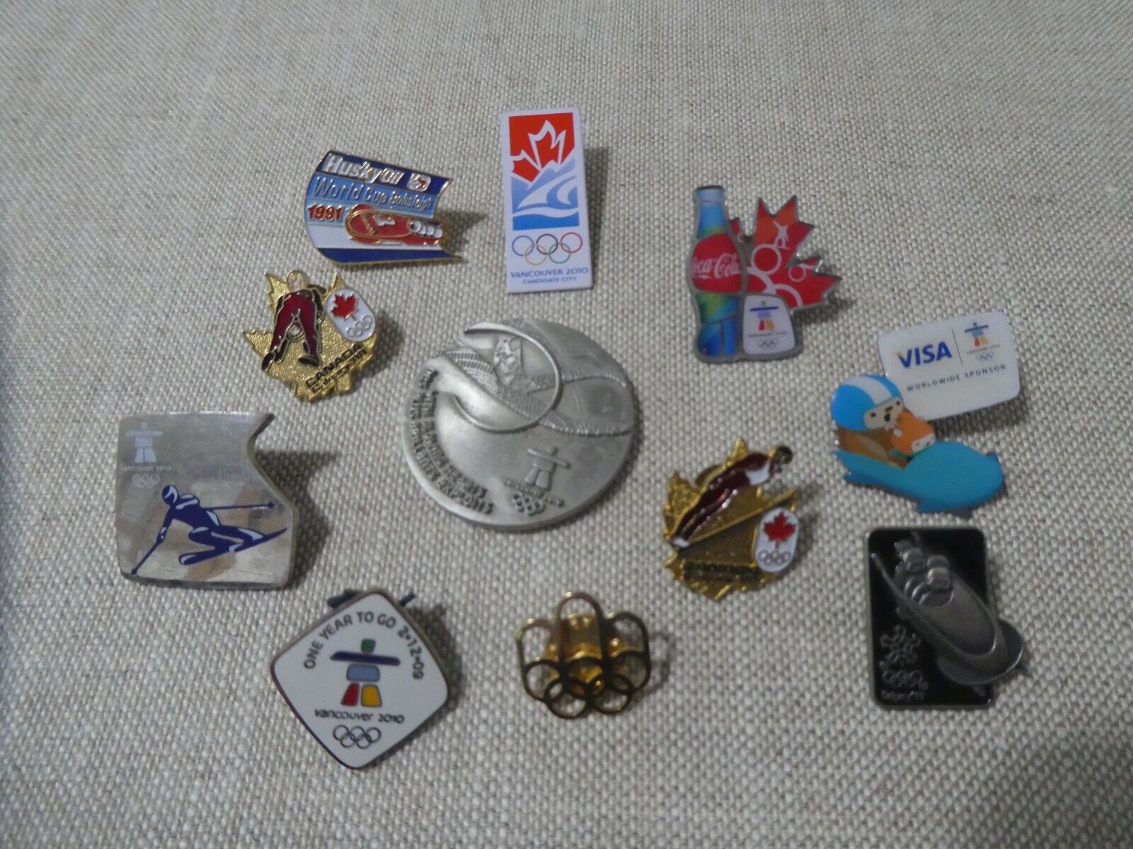OLYMPIC WINTER GAMES PIN LOT CALGARY 1988 VANCOUVER 2010 + OLYMPIC COIN