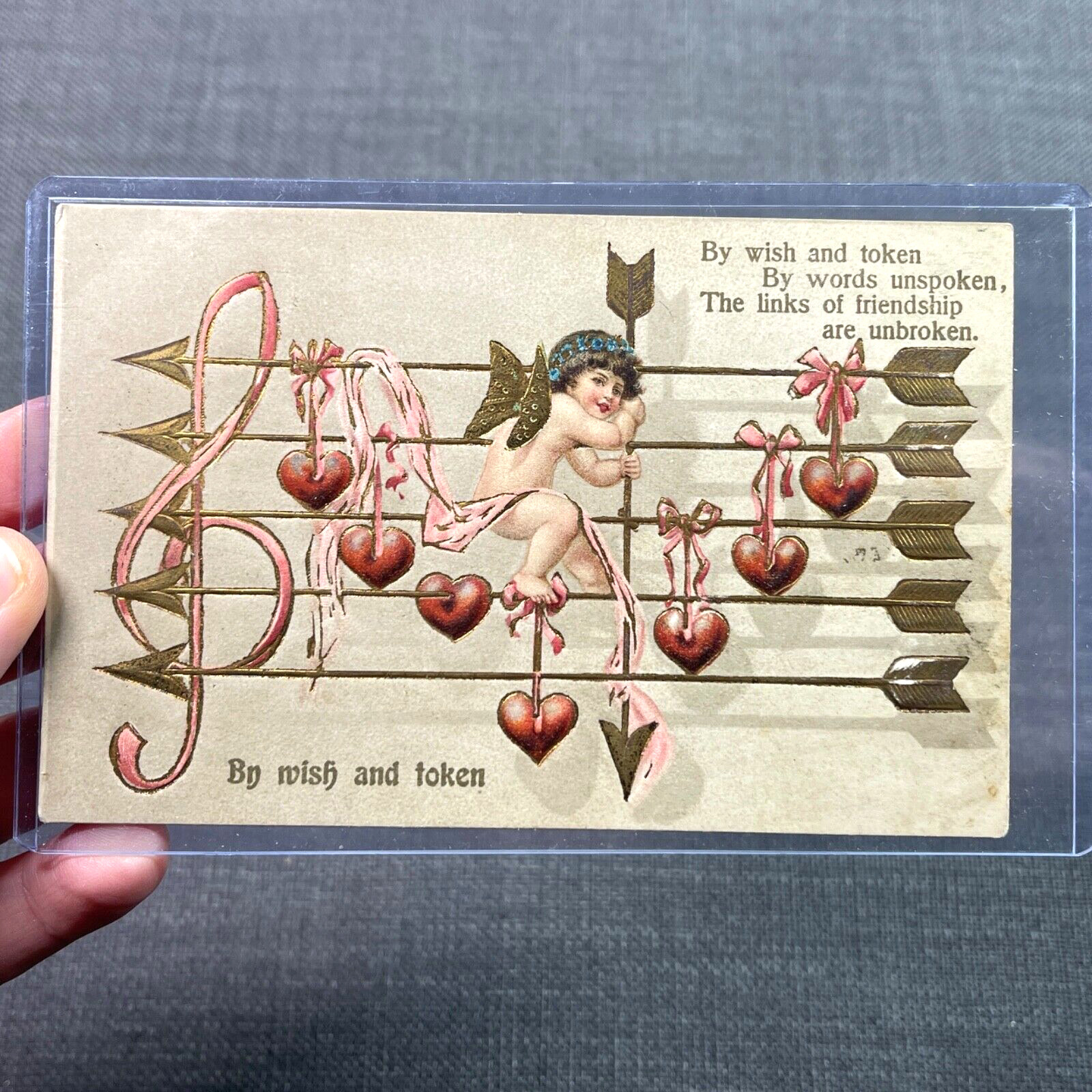 Antique Postcard Germany Embossed Valentine with Cupid on Music Staff of Arrows