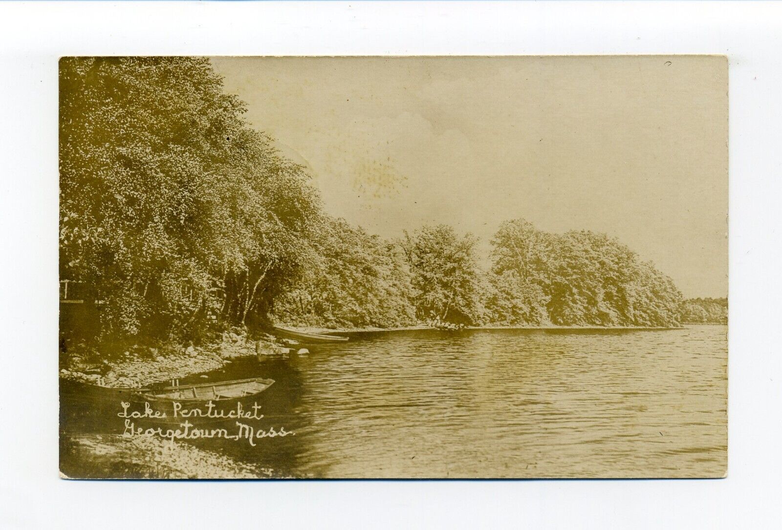 Georgetown MA RPPC photo postcard, Lake Pentucket, rowboat, trees along water
