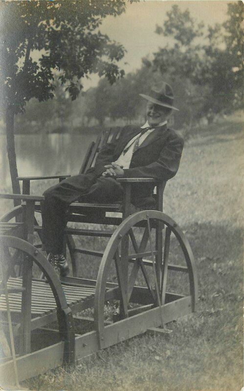 C-1910 Man Lakeside Wagon Swing Chair RPPC Photo Postcard 21-13314