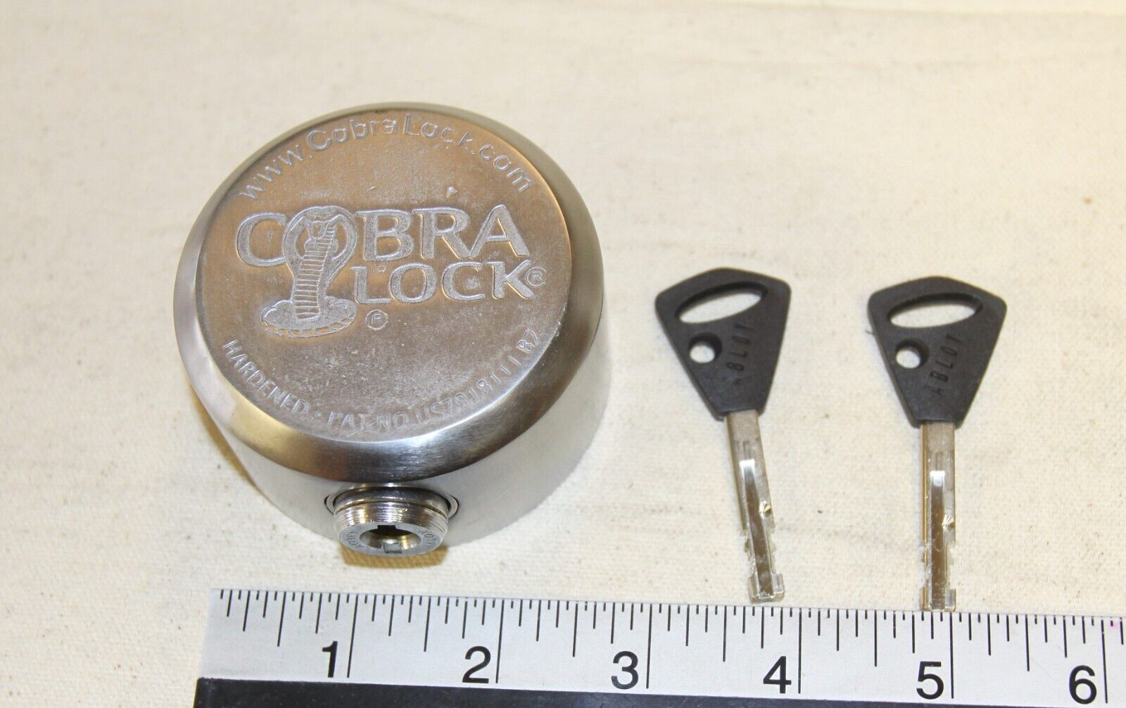 Cobra satin heavy steel puck lock with an Abloy locking cylinder & 5 keys