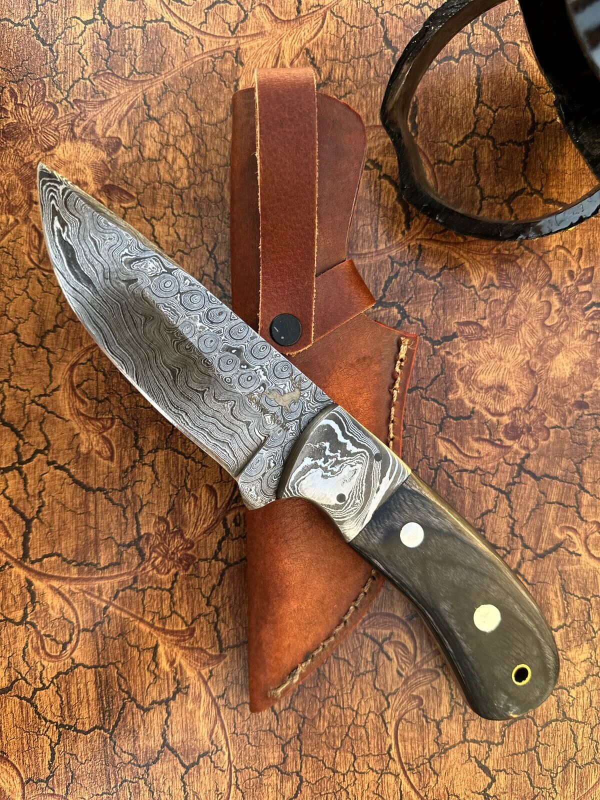 hand made custom hunting knife with bond handle and pins