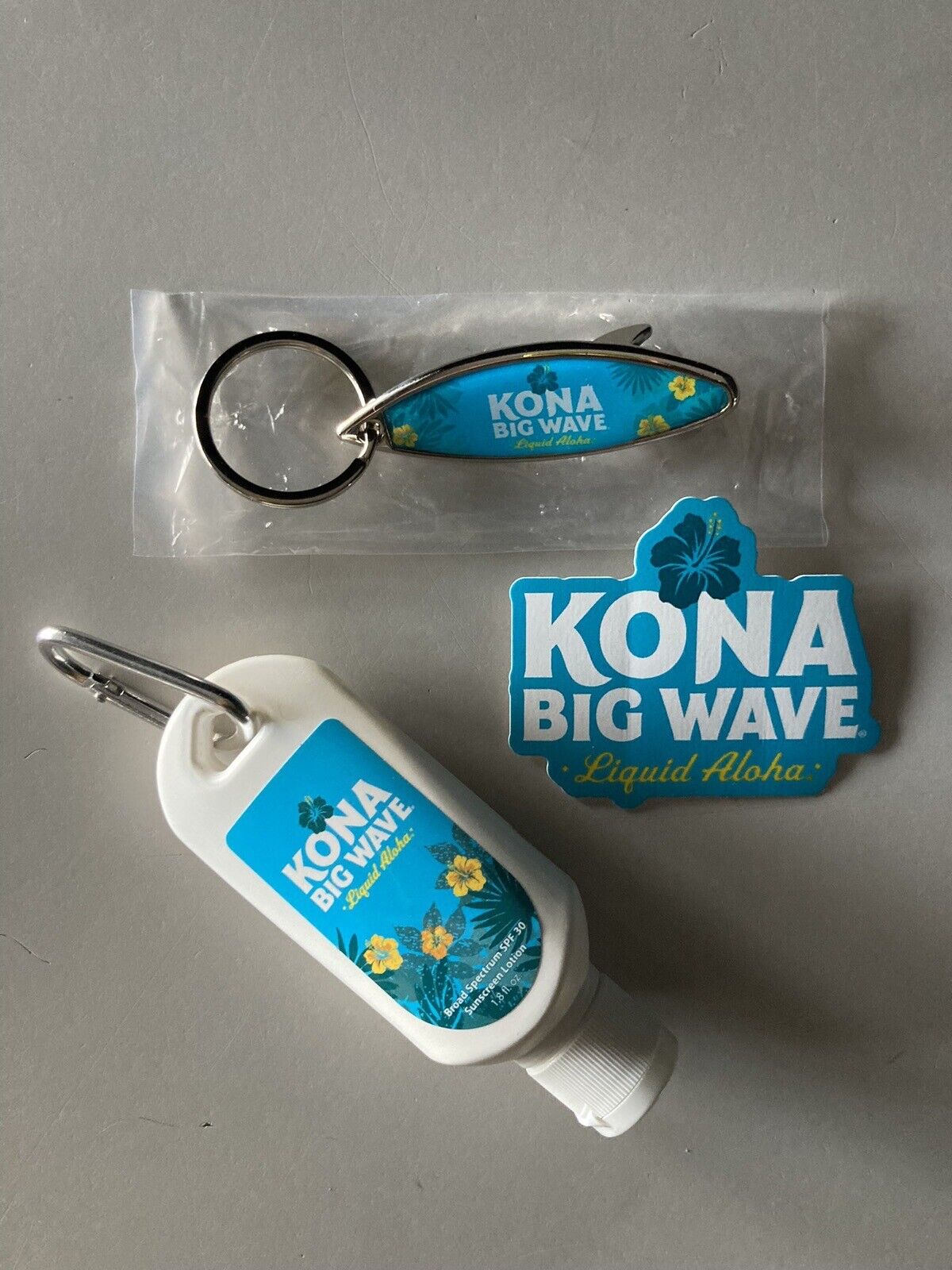 NEW Kona Big Wave Beer Bottle Metal Opener Key Chain Sticker Sun Tan Lotion