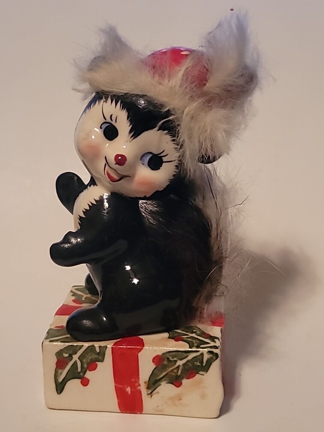 Antique/Vintage Japan Ceramics Christmas Skunk Figurine Sitting Pretty on Gift