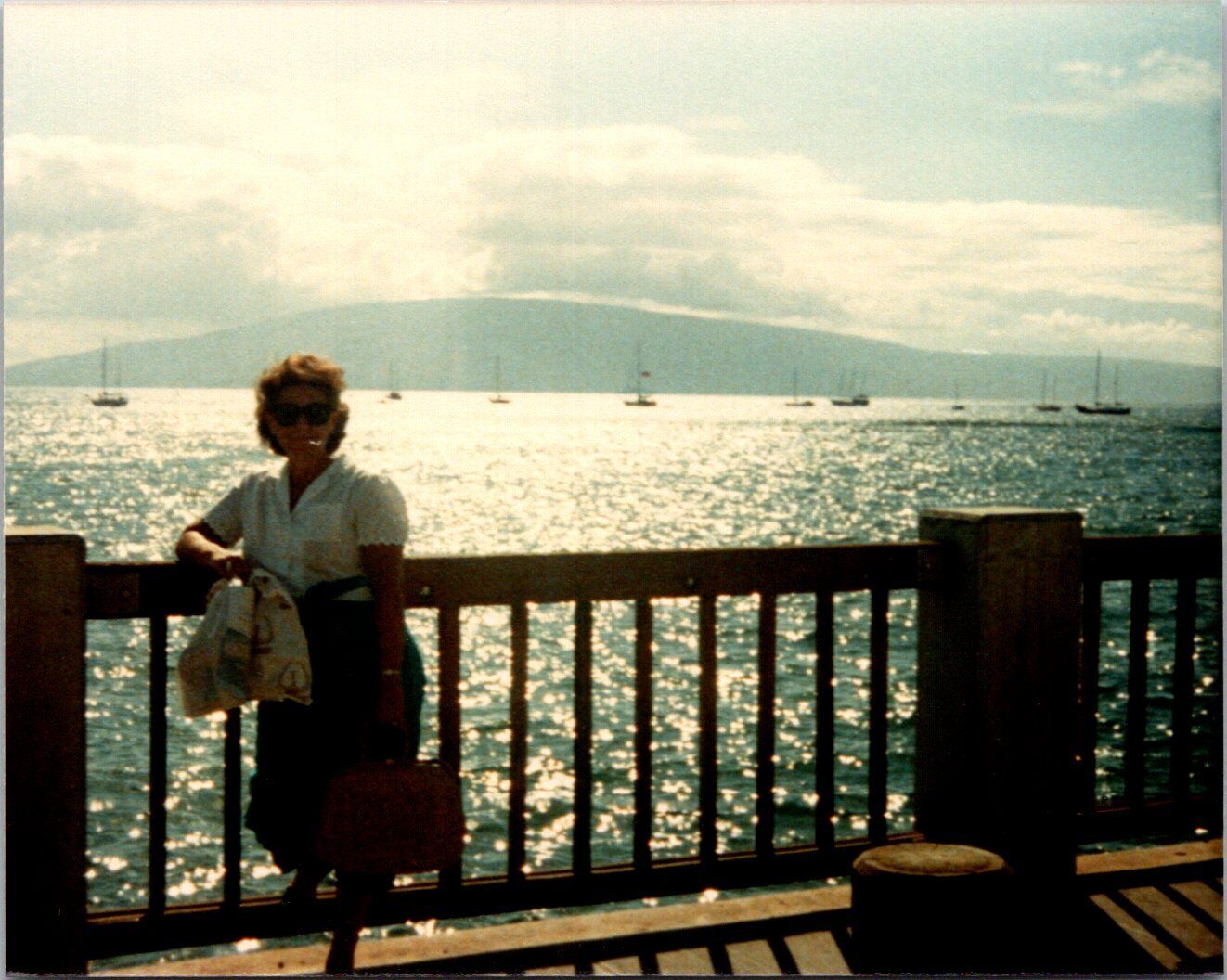 Woman with mountains & boats in the water behind her Hawaii Found Photo V1334