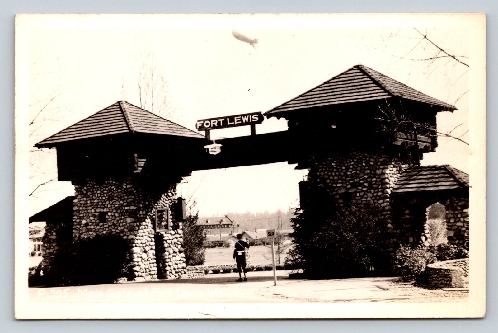 c1948 RPPC Main Gate At Fort Lewis Wn Blimp In Sky RARE VINTAGE Postcard