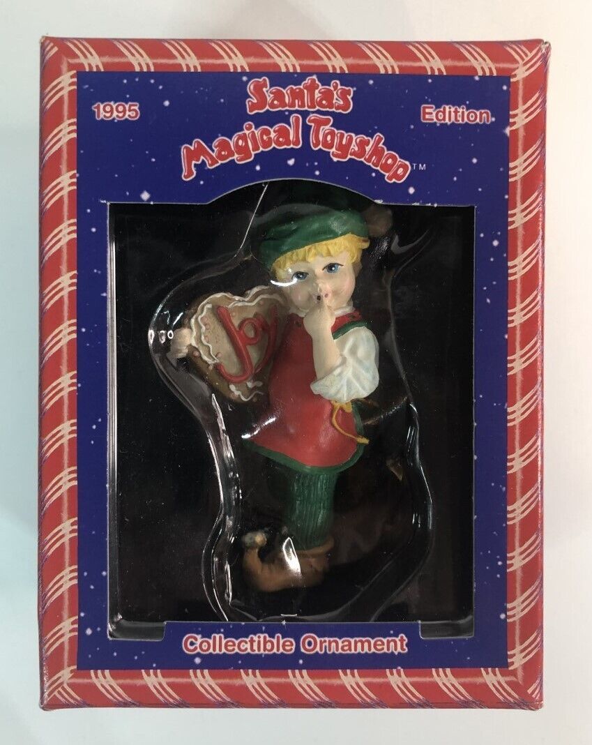 1995 Santa's Magical Toy Shop Christmas Ornament Elf Holding a Cookie with Joy