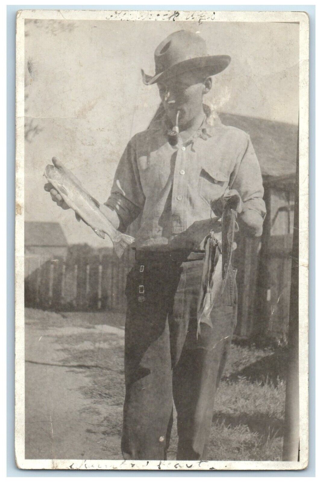 c1910's Boy Cached Fishes Smoking Pipe Glenrock Wyoming WY RPPC Photo Postcard