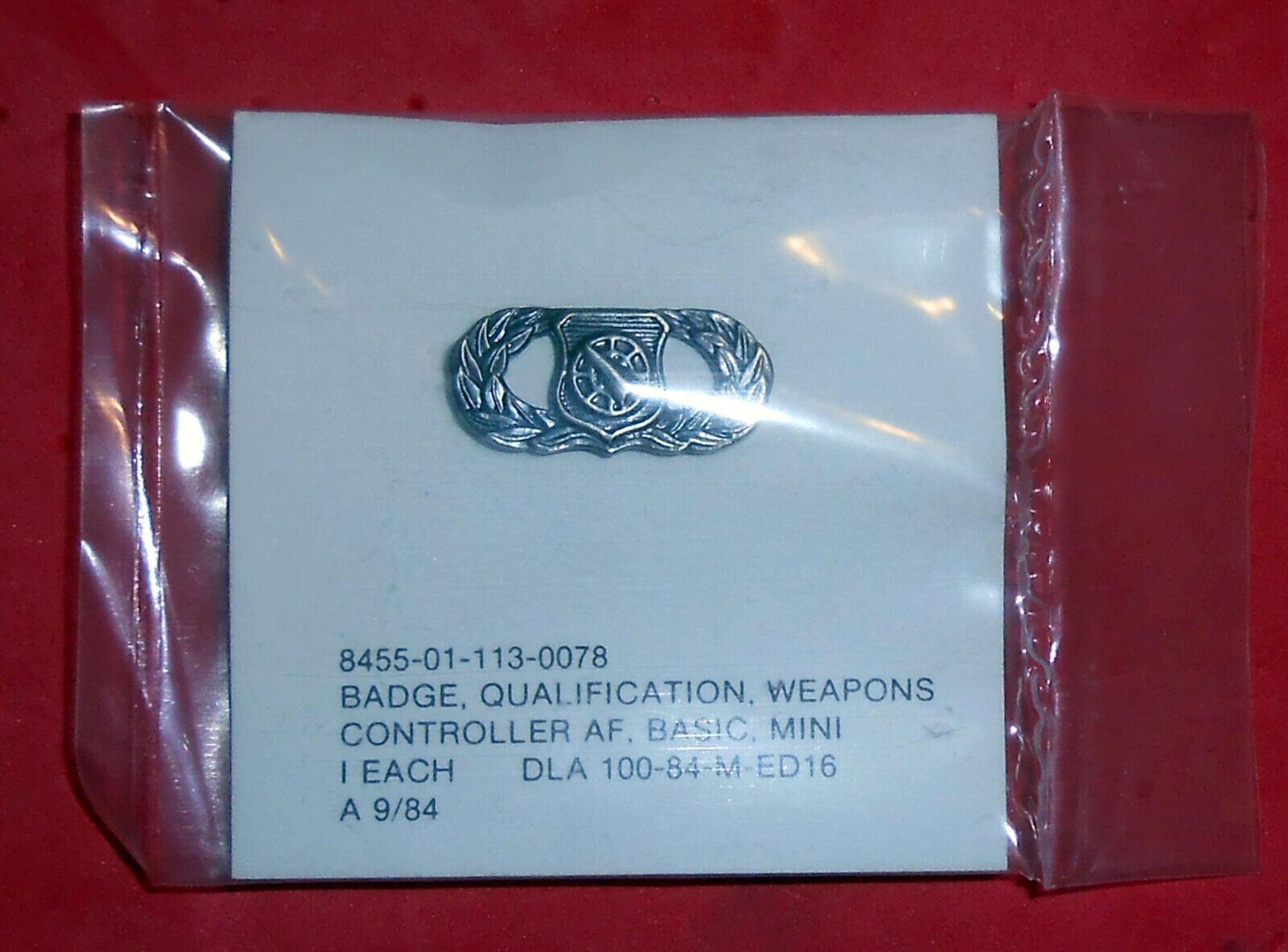 WA15 USAF qualifi. badge Weapons Controller, mini, dated 9/84 original package