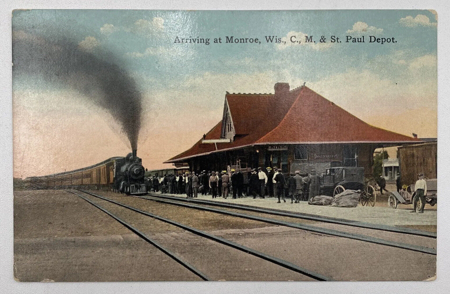 Postcard WI Arriving At Monroe Wisconsin C. M. & St Paul Depot Railroadiana UNP