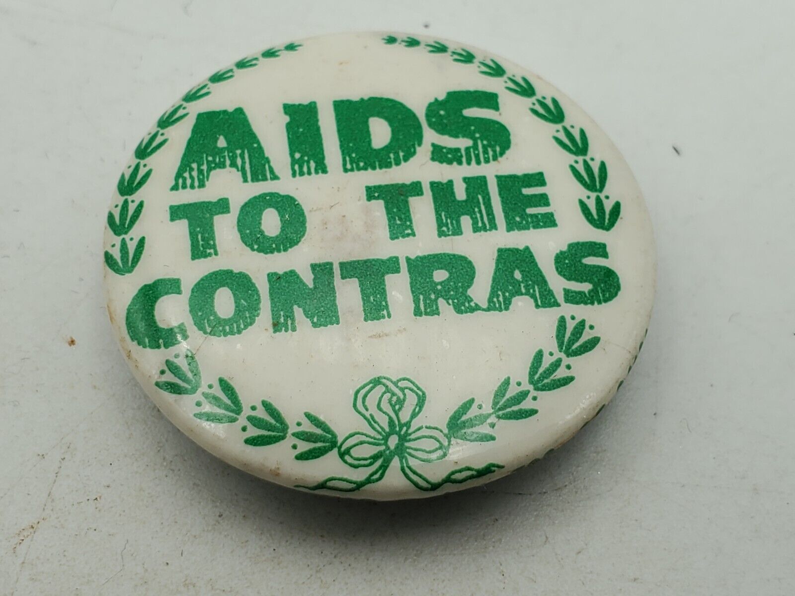 Vintage AIDS TO THE CONTRAS Badge Button PIn Pinback As Is S1