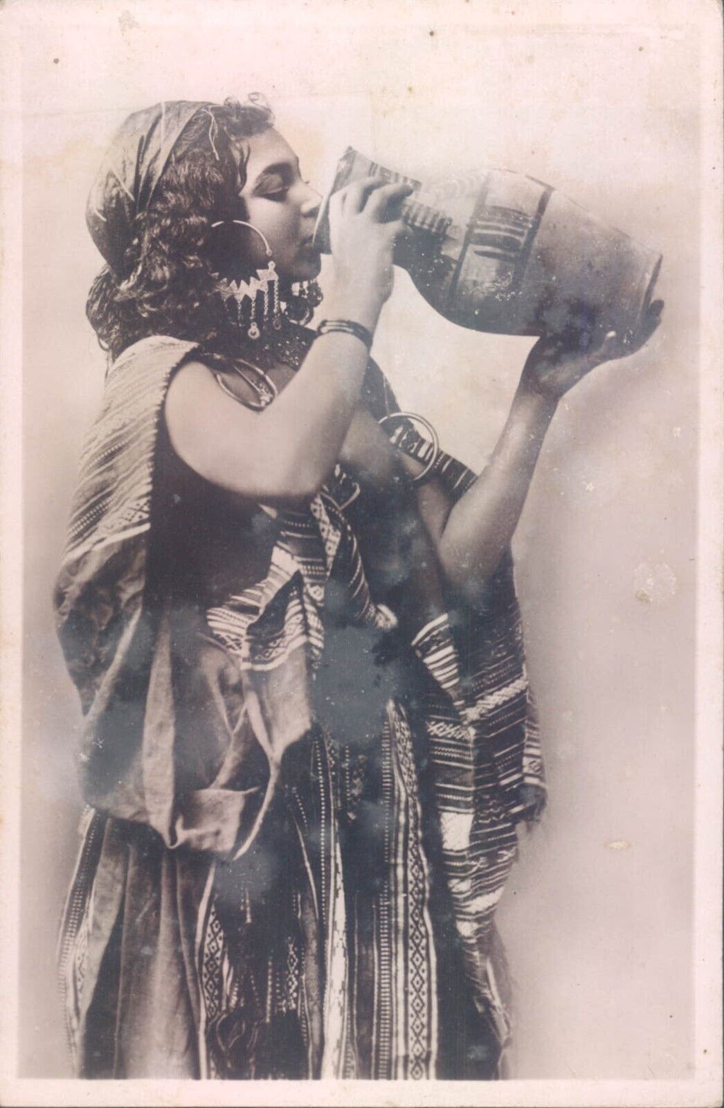ALGERIA young bedouin girl drinking RPPC 1910s