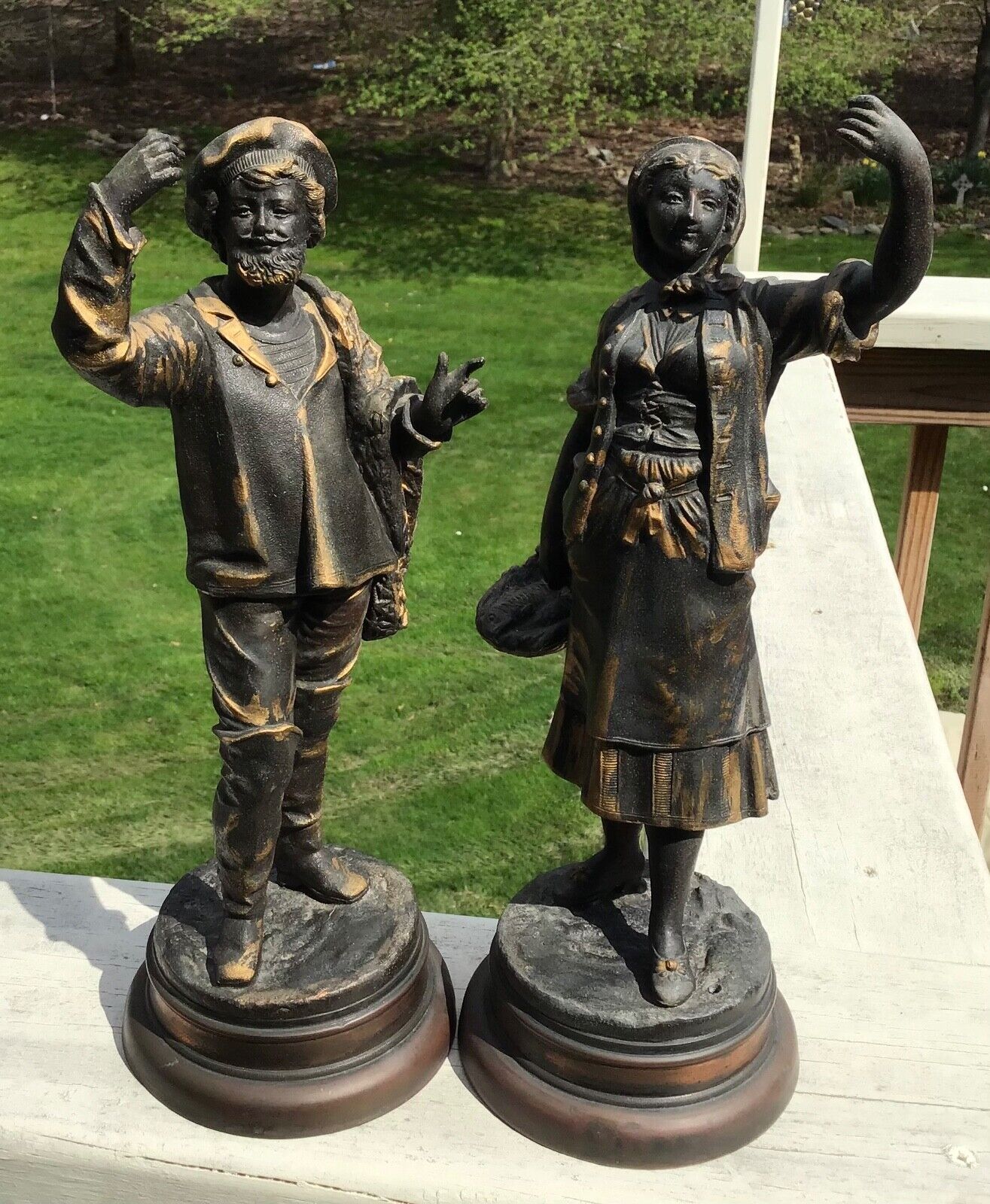 PAIR OF VINTAGE SPELTER STATUES, WOMAN WITH FISH, MAN WEARING TAM