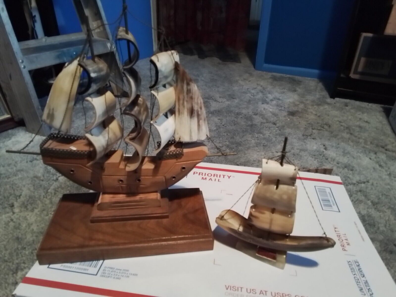 One large one small Sailboat With real  Horn Sails