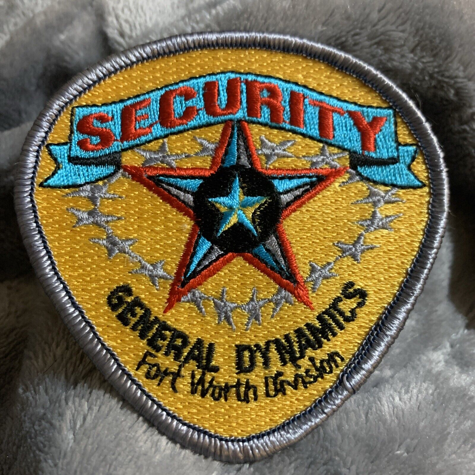 VINTAGE GENERAL DYNAMICS SECURITY PATCH FT WORTH TEXAS DIVISION-gold Background