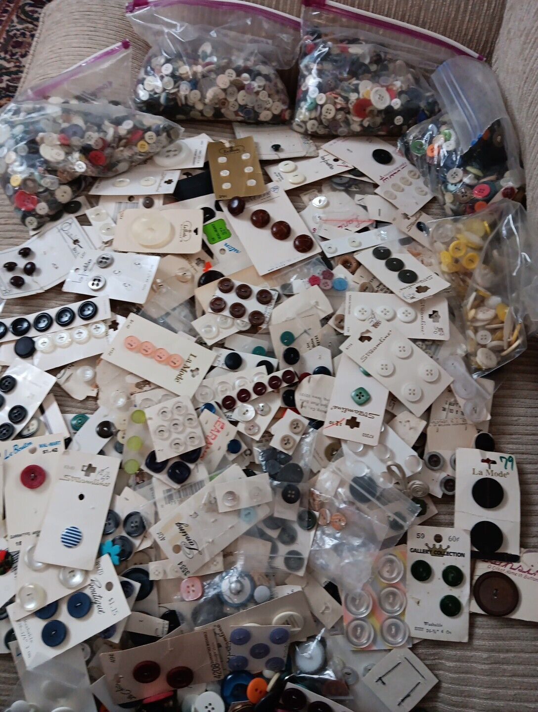 huge mixed lot of buttons. loose and  some on cards small to large