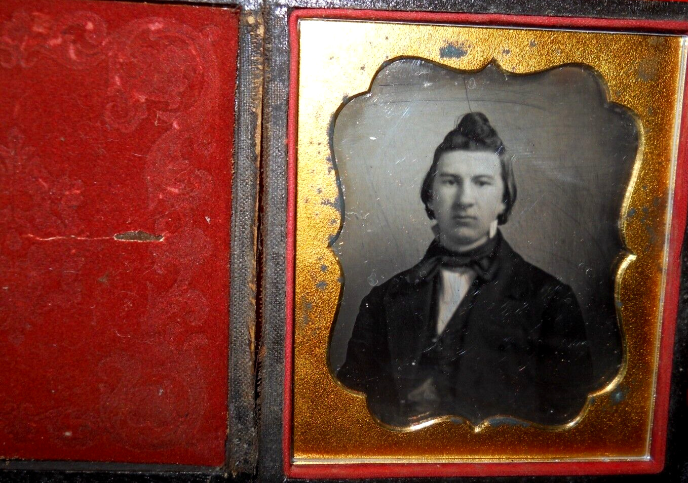 1/6th size Daguerreotype of young man in full case, split at hinge