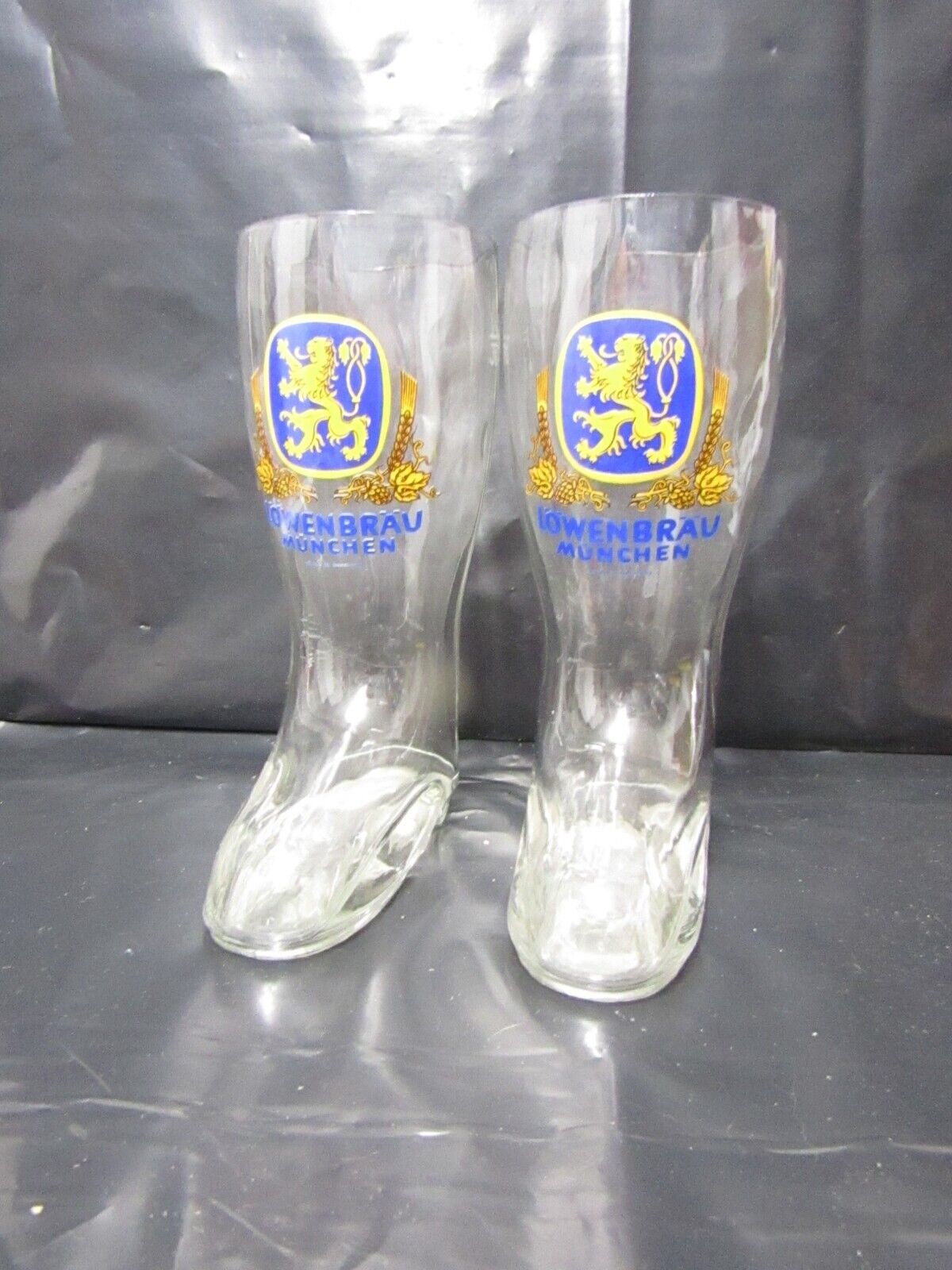 A pair of Lowenbrau Boot Glass.   Vintage brewmania / Man cave item. Great fun