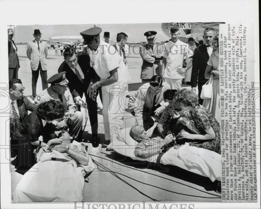 1962 Press Photo Former Laotian prisoners greeted by family at Andrews AFB.