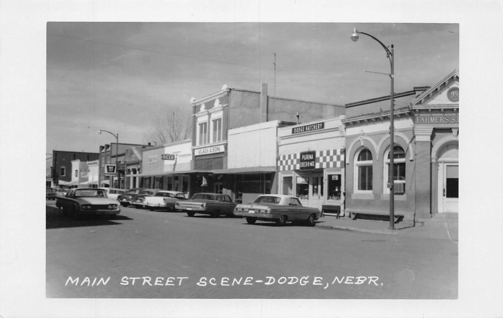 J82/ Dodge Nebraska RPPC Postcard c40-50s Main Street Stores 438