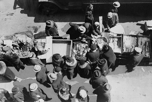 Overhead view of East Side residents buying products from street v .. Old Photo