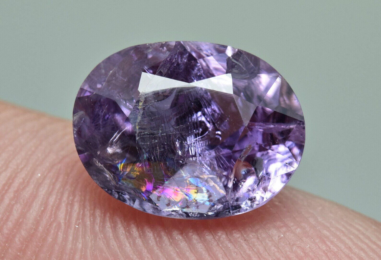 Nice Oval Faceted Fluorescent Purple Scapolite Gemstone w/ Dispersion1.70 Carat