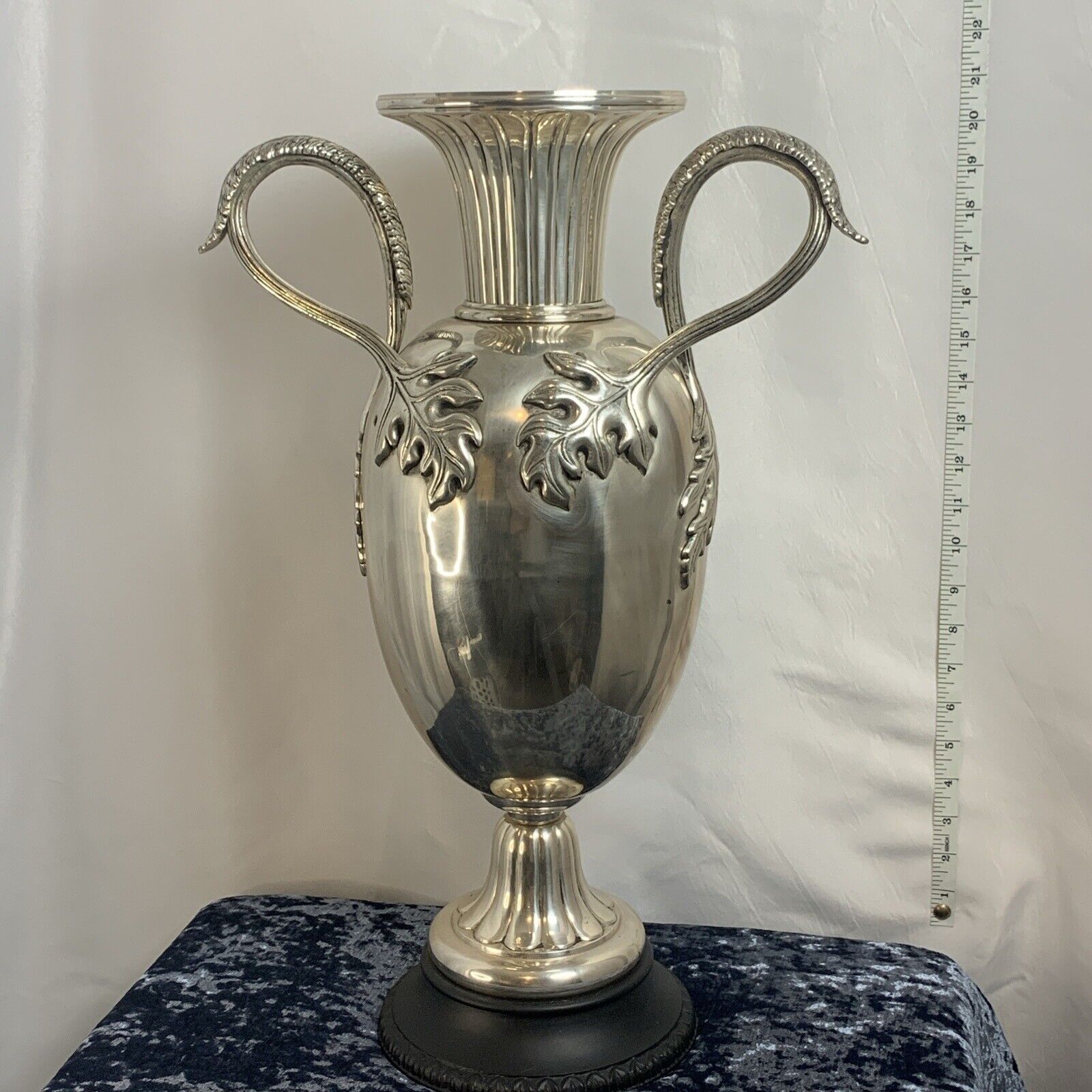 Italian Neoclassical Large Silver Plated Urn on Black Plinth Base. Read More.
