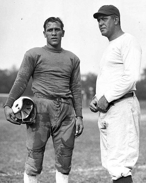Football practice Joe La Mark captain and Coach Howard Cann  .. Old Photo