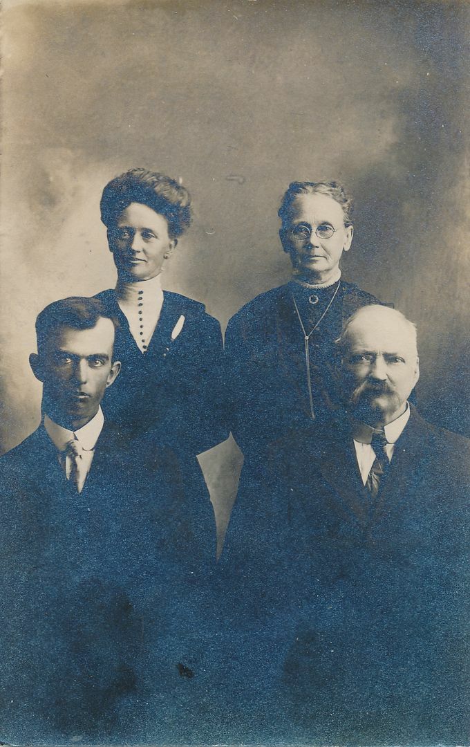 Four Serious Looking People Real Photo Postcard rppc