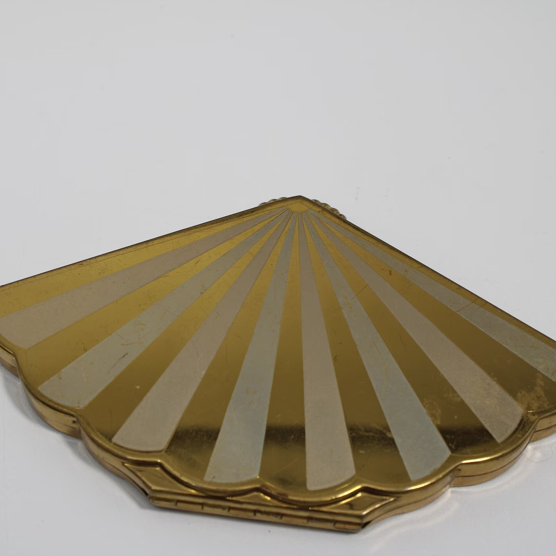 Vintage Wadsworth Henrietta Gold Tone Fan Shaped Compact from the 1940's