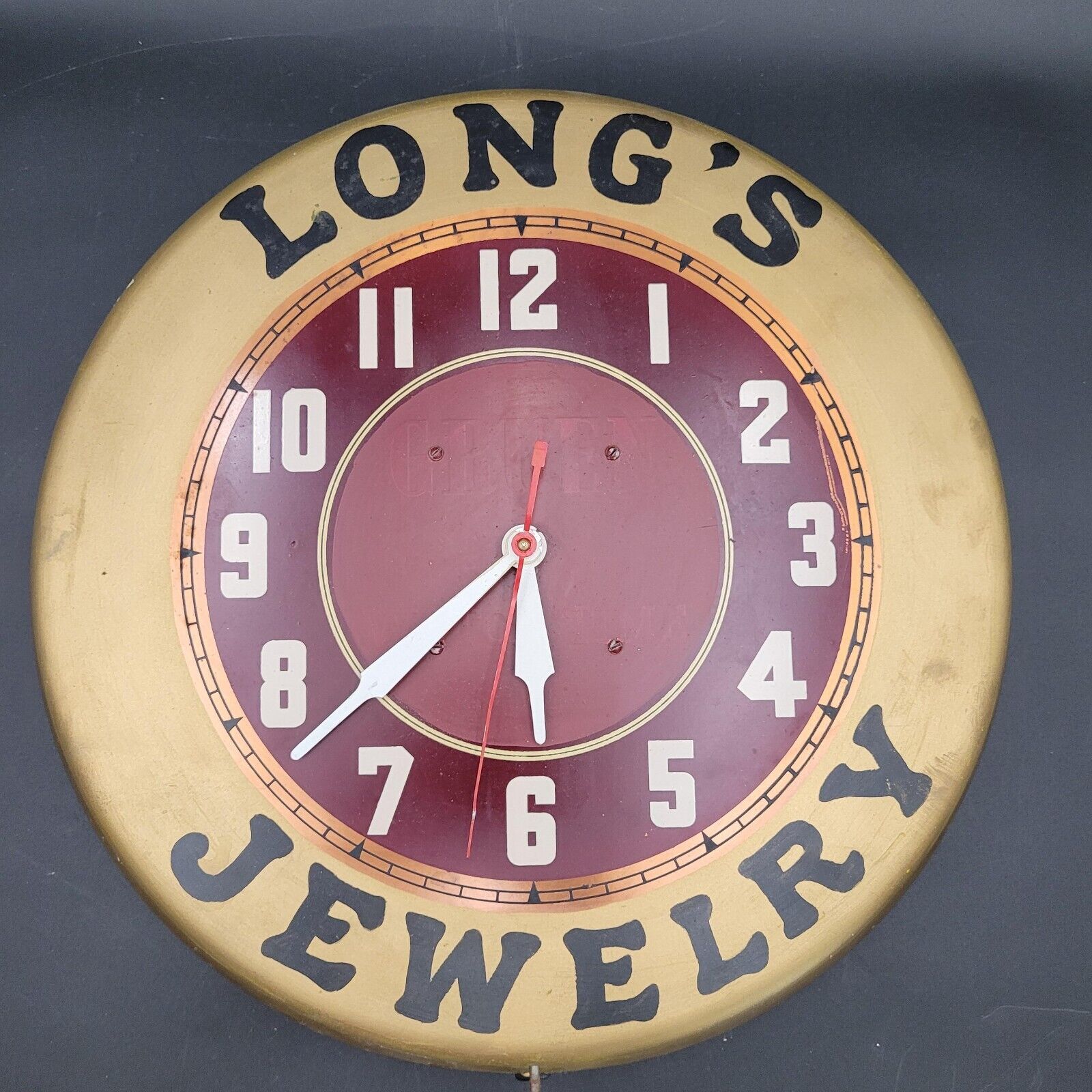 Vintage Gruen GC7 Long\'s Jewelry Jewelers Advertising Red Gold Tin Wall Clock