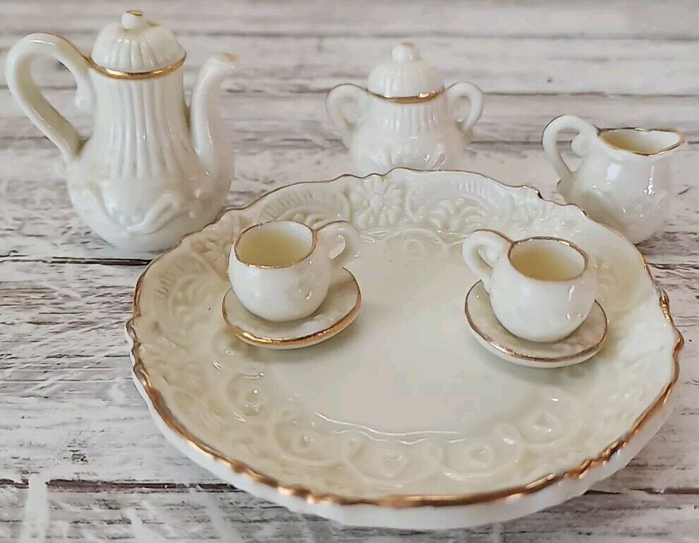 Small Tea Set With gold Trim.