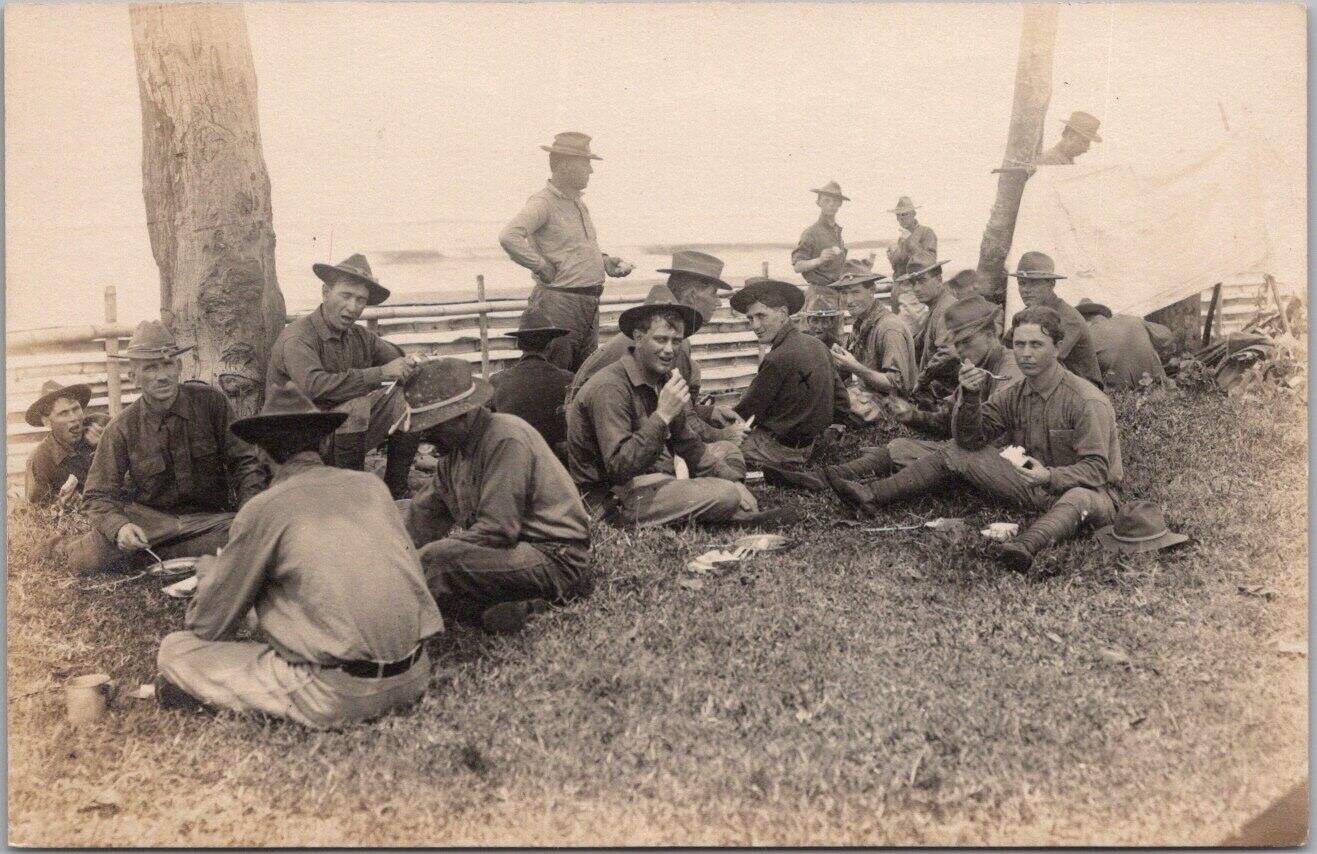 1910s WWI Military RPPC Photo Postcard Soldiers / Eating on Ground / Mess Scene
