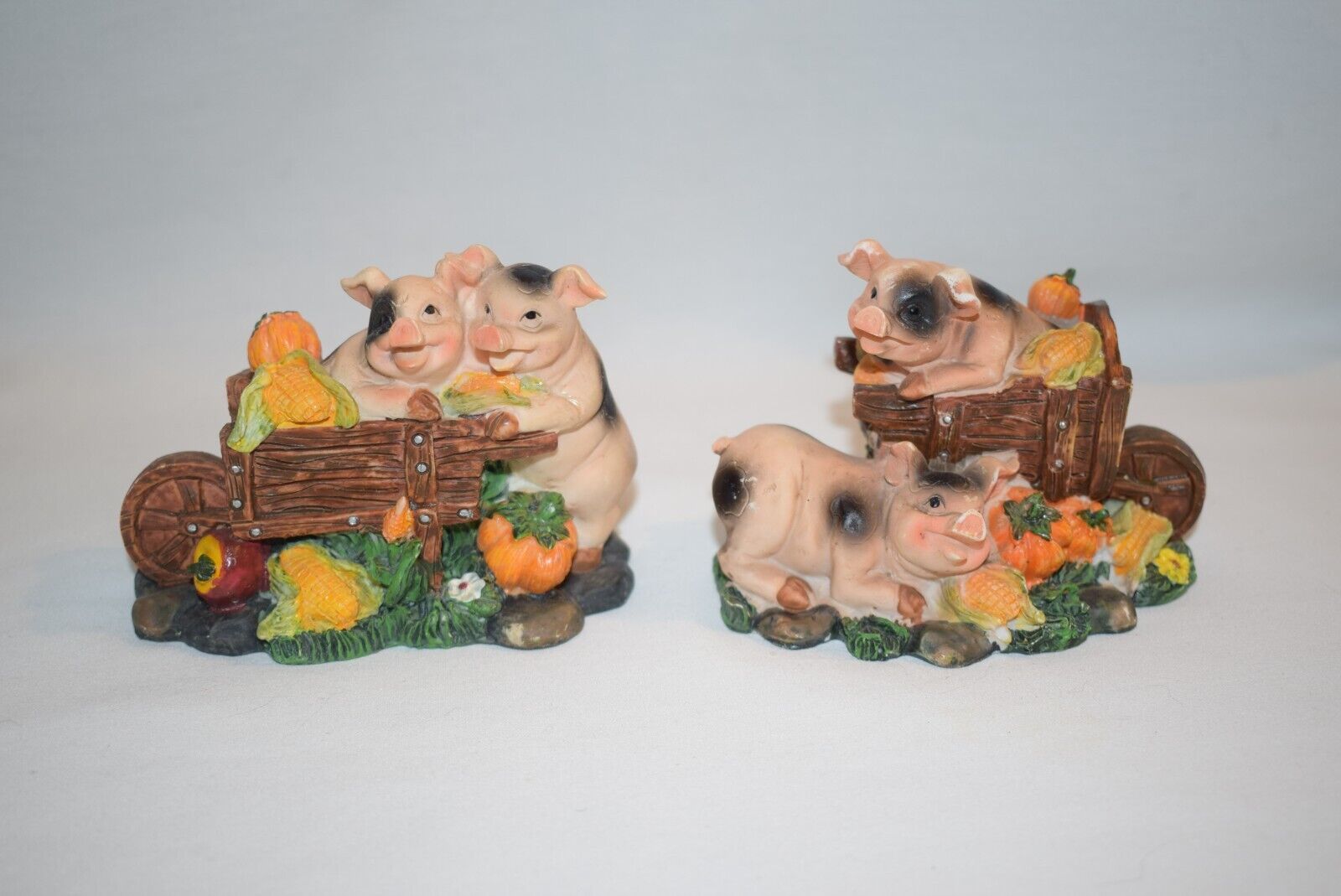 Resin Pair of Pair of Pigs In Wheelbarrow Figures