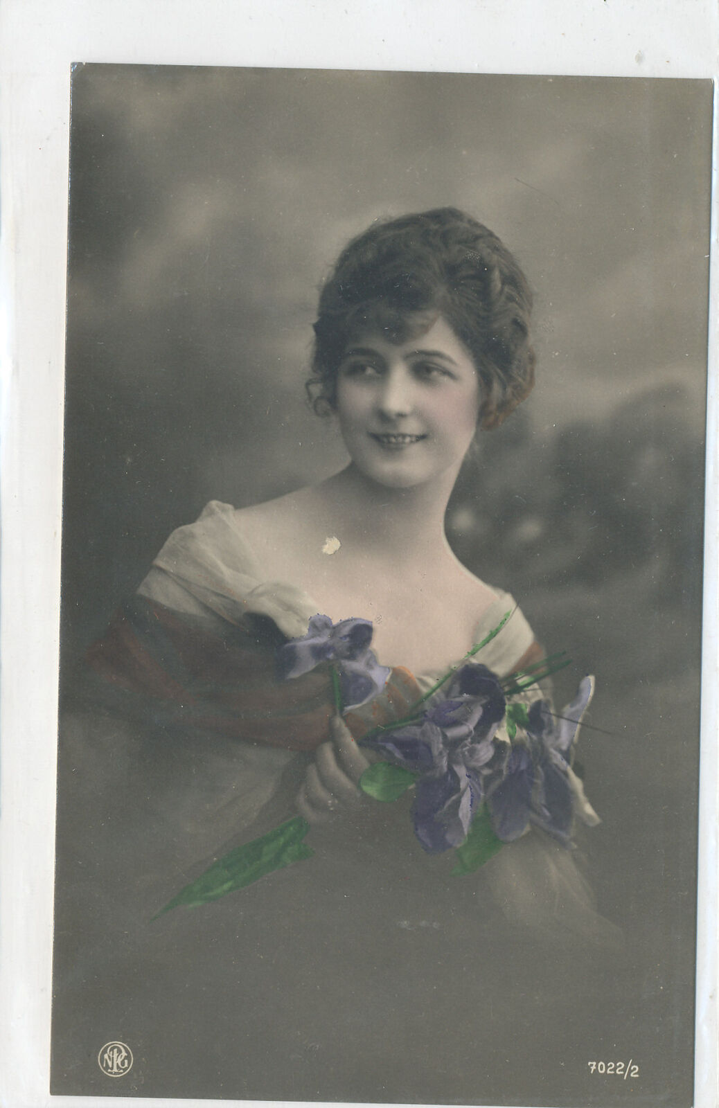Postcard - Hand tinted Photo - Woman Holding Bunch of Purple Flowers