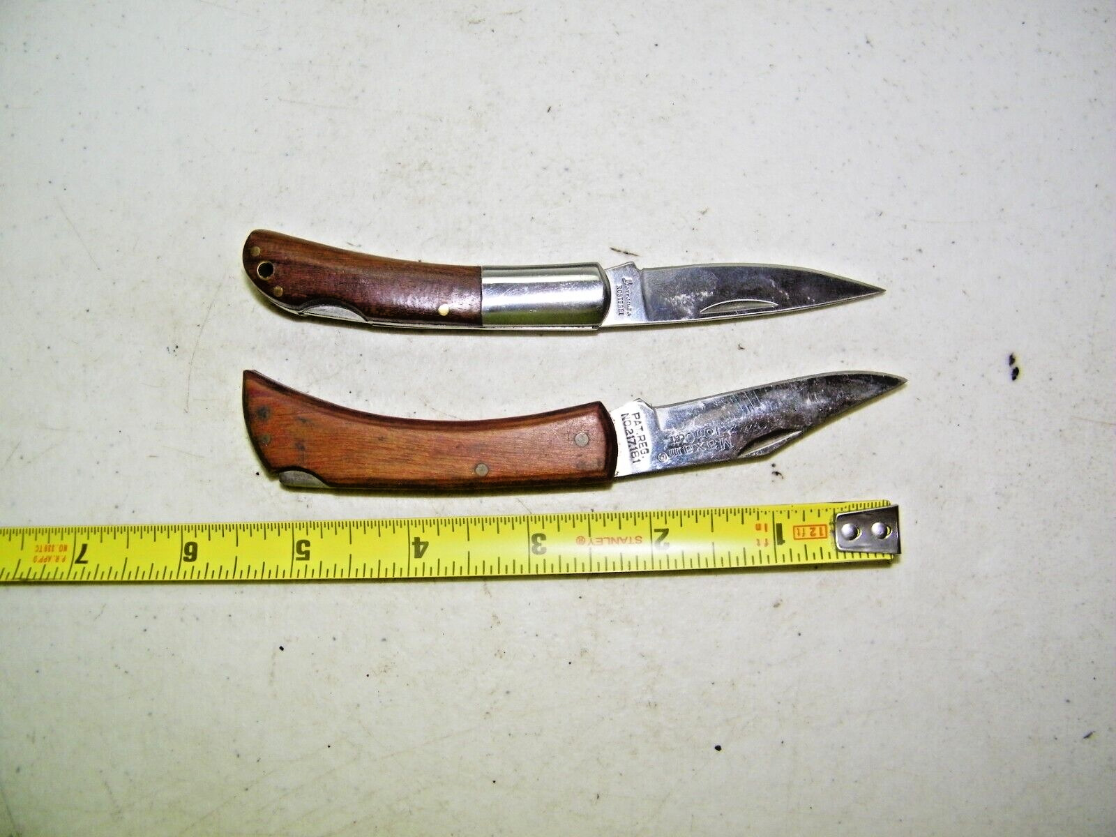 2 Wood handle folding lockback pocket knifes 1 Is Maxam TomCat Made in Japan