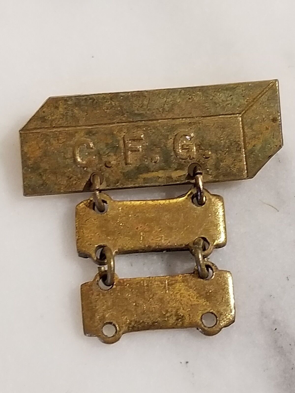 Vintage Gold Tone Medal Pin Marked C. F. G. 