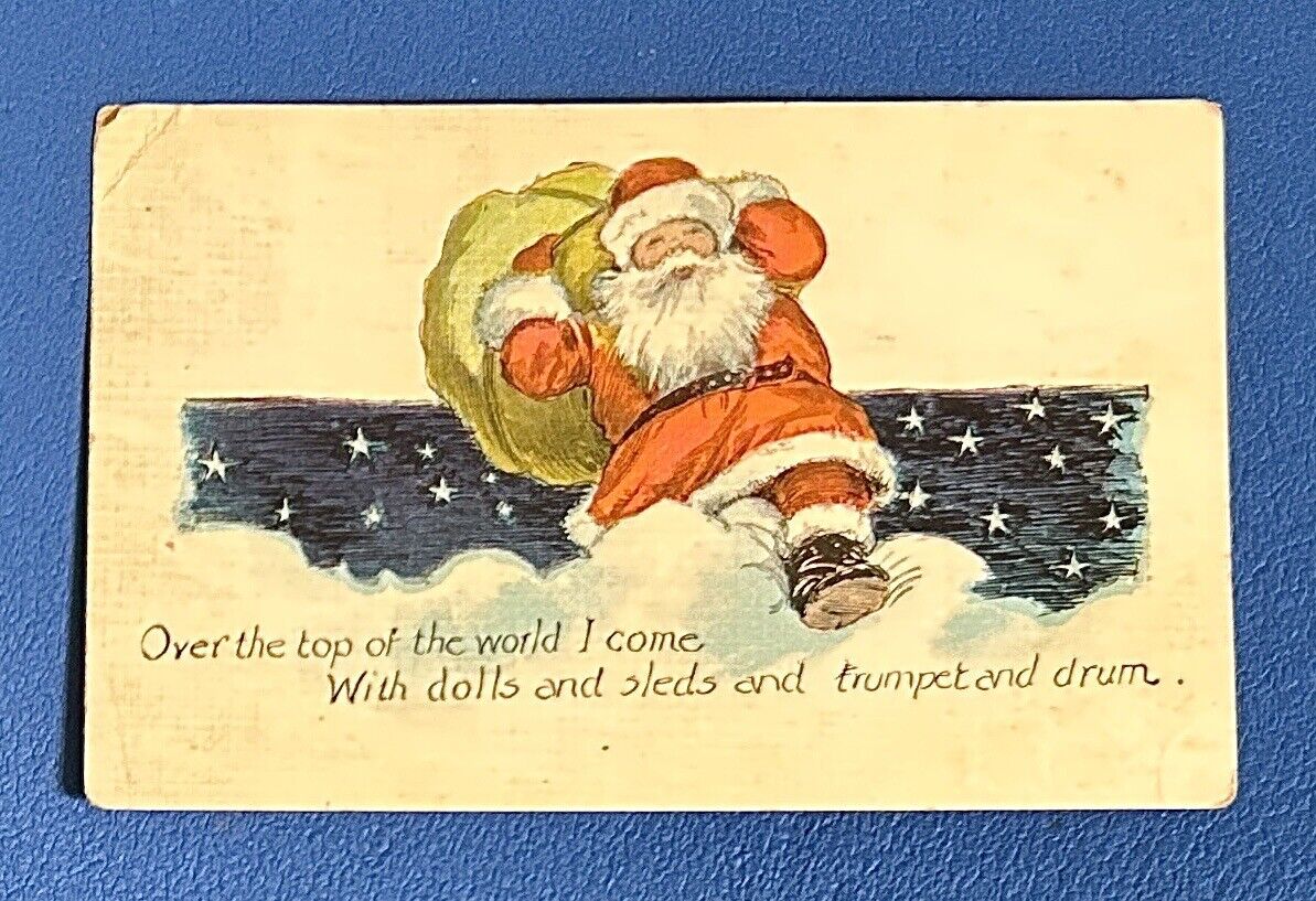 CHRISTMAS Postcard • Santa with Toy Presents Bag Clouds Stars • Posted 1922