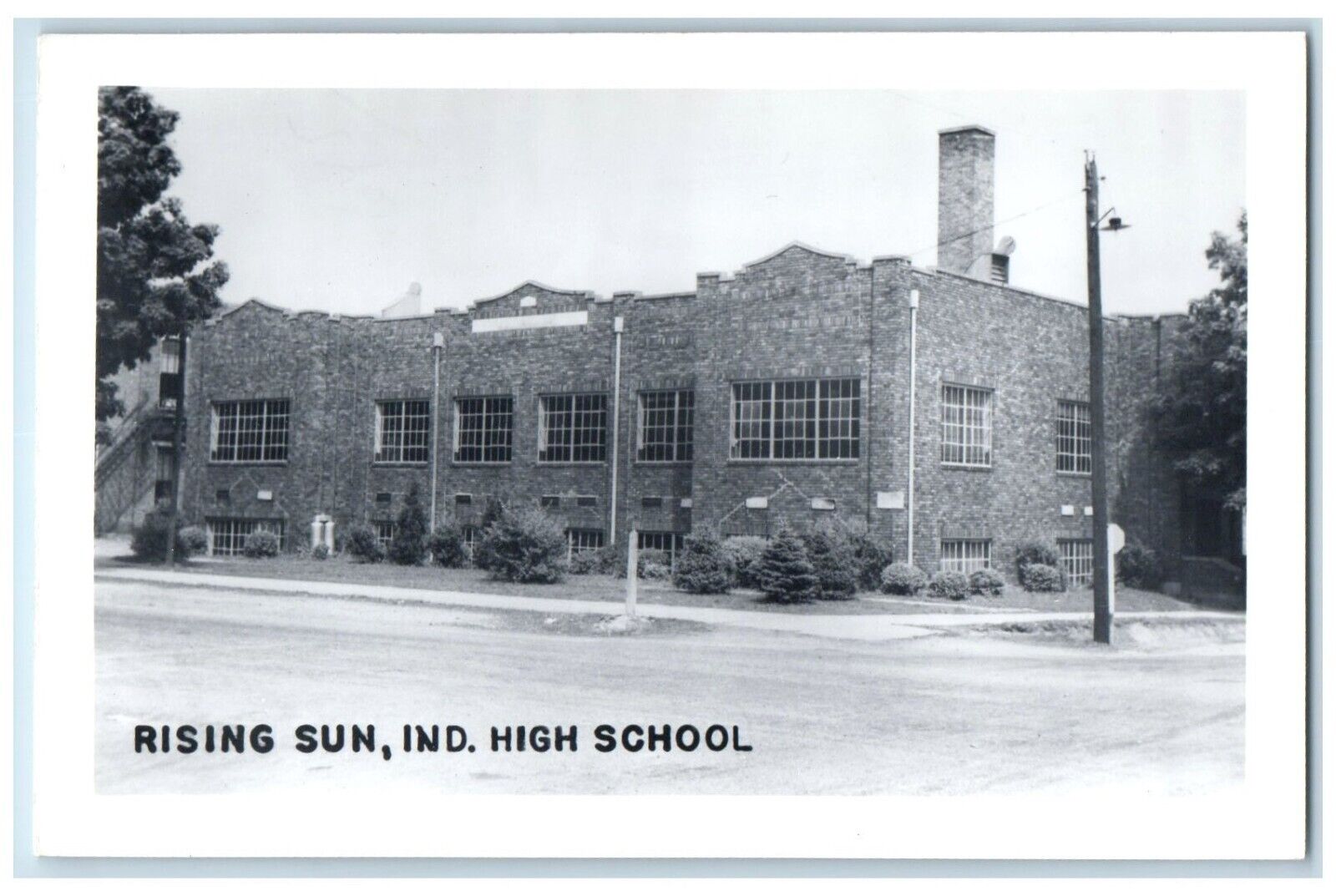 c1950's High School Building Street Scene Rising Sun IN RPPC Photo Postcard