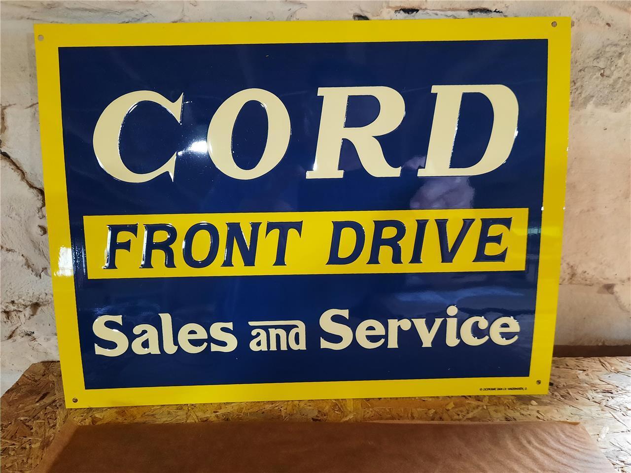 NOS TIN METAL EMBOSSED SIGN CORD FRONT DRIVE SALES SIGN MINT WITH ORIGINAL PAPER