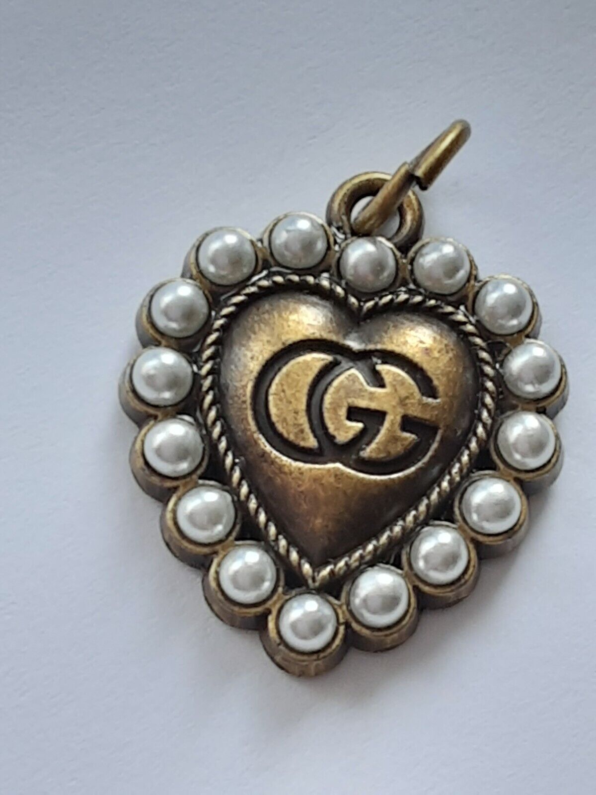 One Gucci  zipper pull 1 inch   GG logo   metal bronze  / Pearls