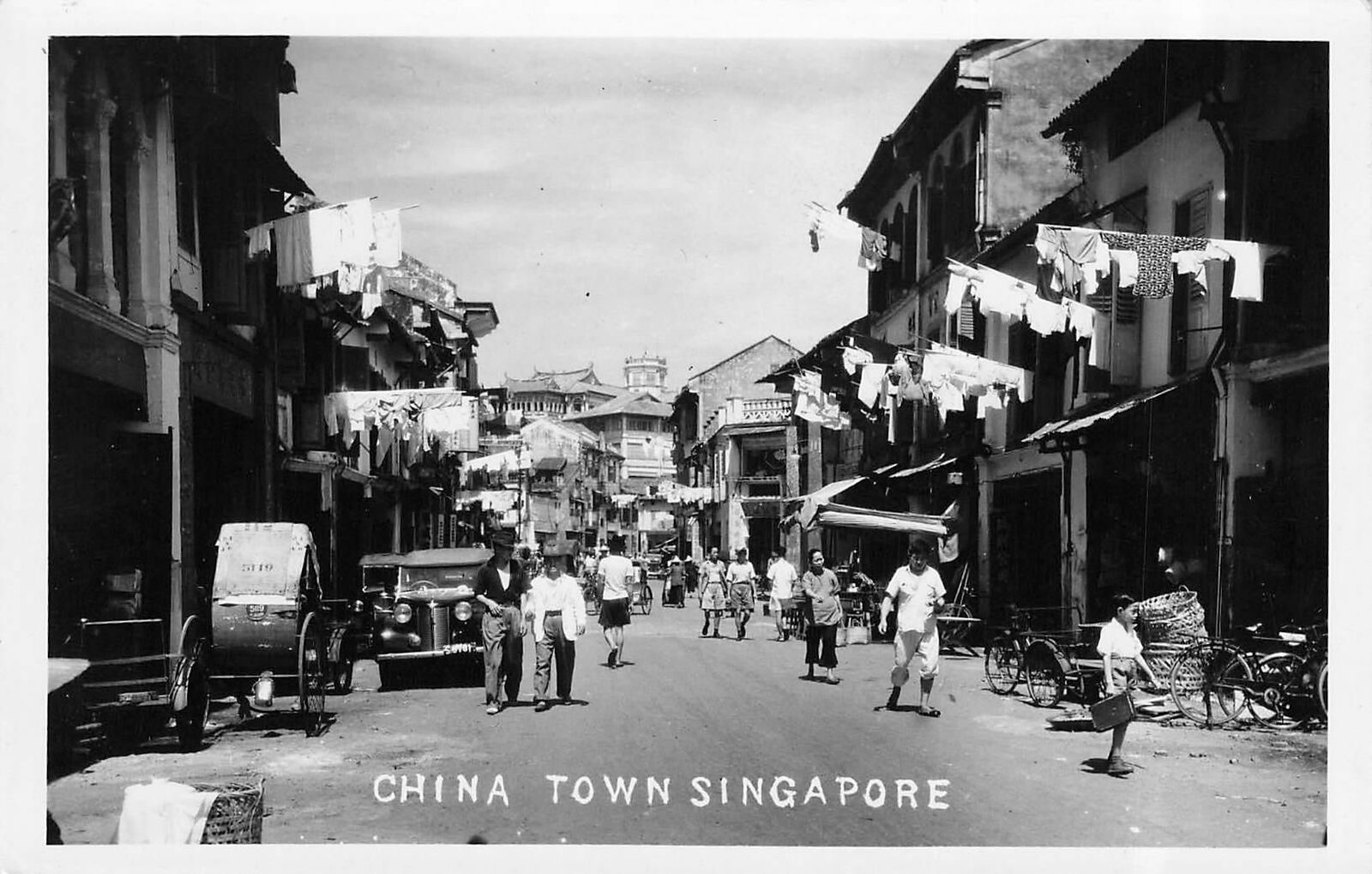 Vintage RPPC China Town Singapore Street Scene Old Cars People Walking Laundry