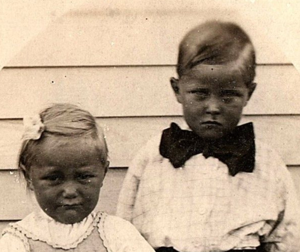 c1910 SULKING BOY & GIRL HUGE BOWTIE NOT LIKING PICTURE DAY RPPC POSTCARD P1337