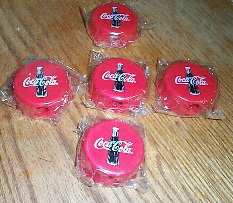 Vintage lot five 1999 Coca Cola pencil sharpeners sealed in original packaging