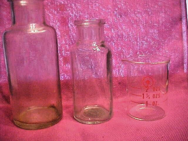 Vintage Lot Of 2  Glass Apothecary Medical  Bottles, and 1 small measuring cup