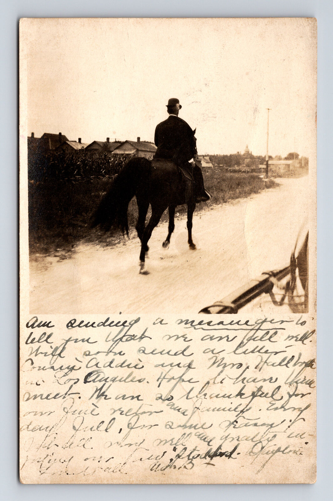 c1909 RPPC Man Derby Hat Riding Dark Horse Down Street Columbus IN Postcard