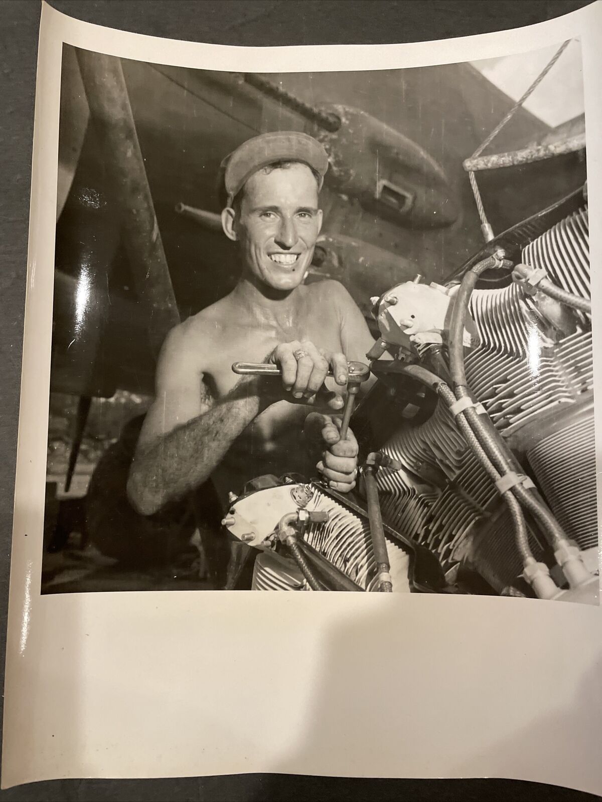 WWII press photo B25 Aircraft Crew Chief Repairing Engine, Yank Magazine