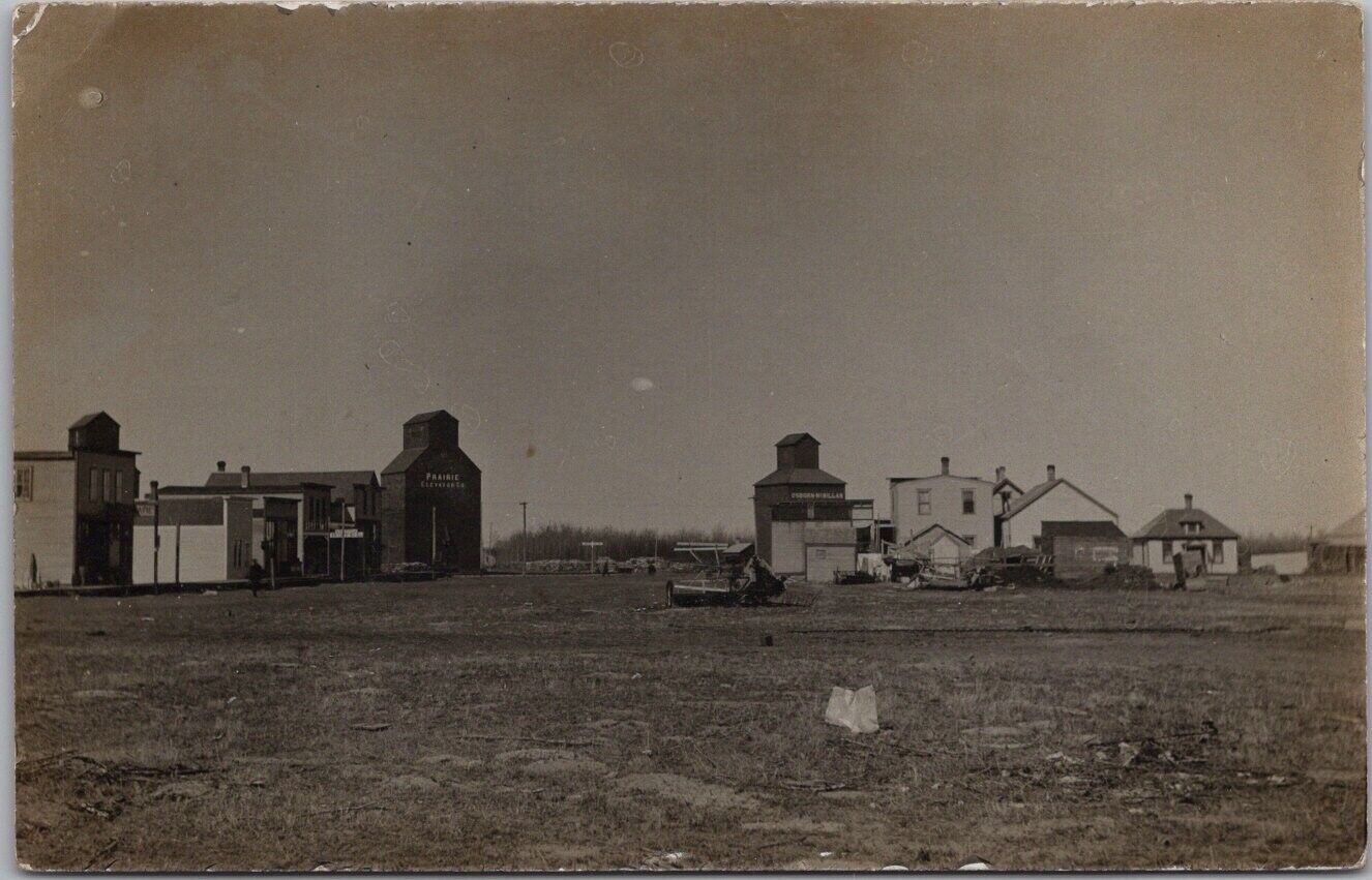 1910s RPPC Photo Postcard Main Street Scene / Grain Elevators Poss. North Dakota