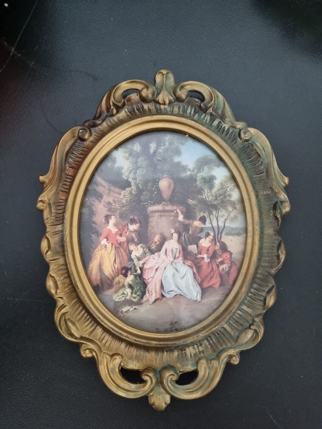 Vintage Oval Scrolling Gold Finish Plastic frame with Romantic Print.